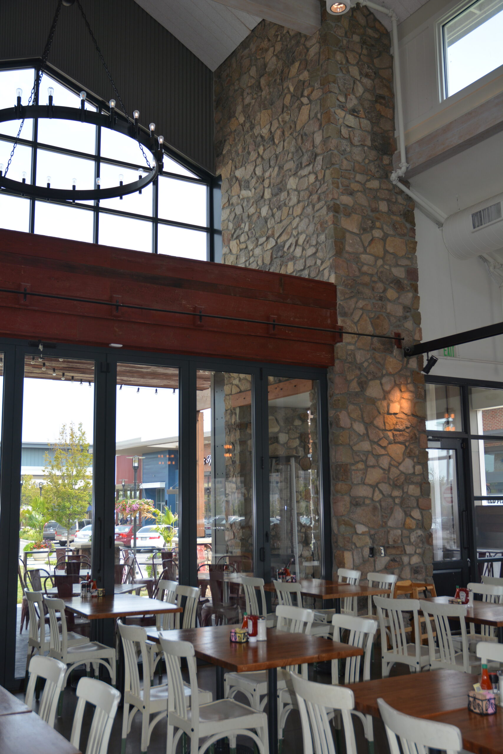 Natural Stone veneer installed on an interior wall to the high ceiling