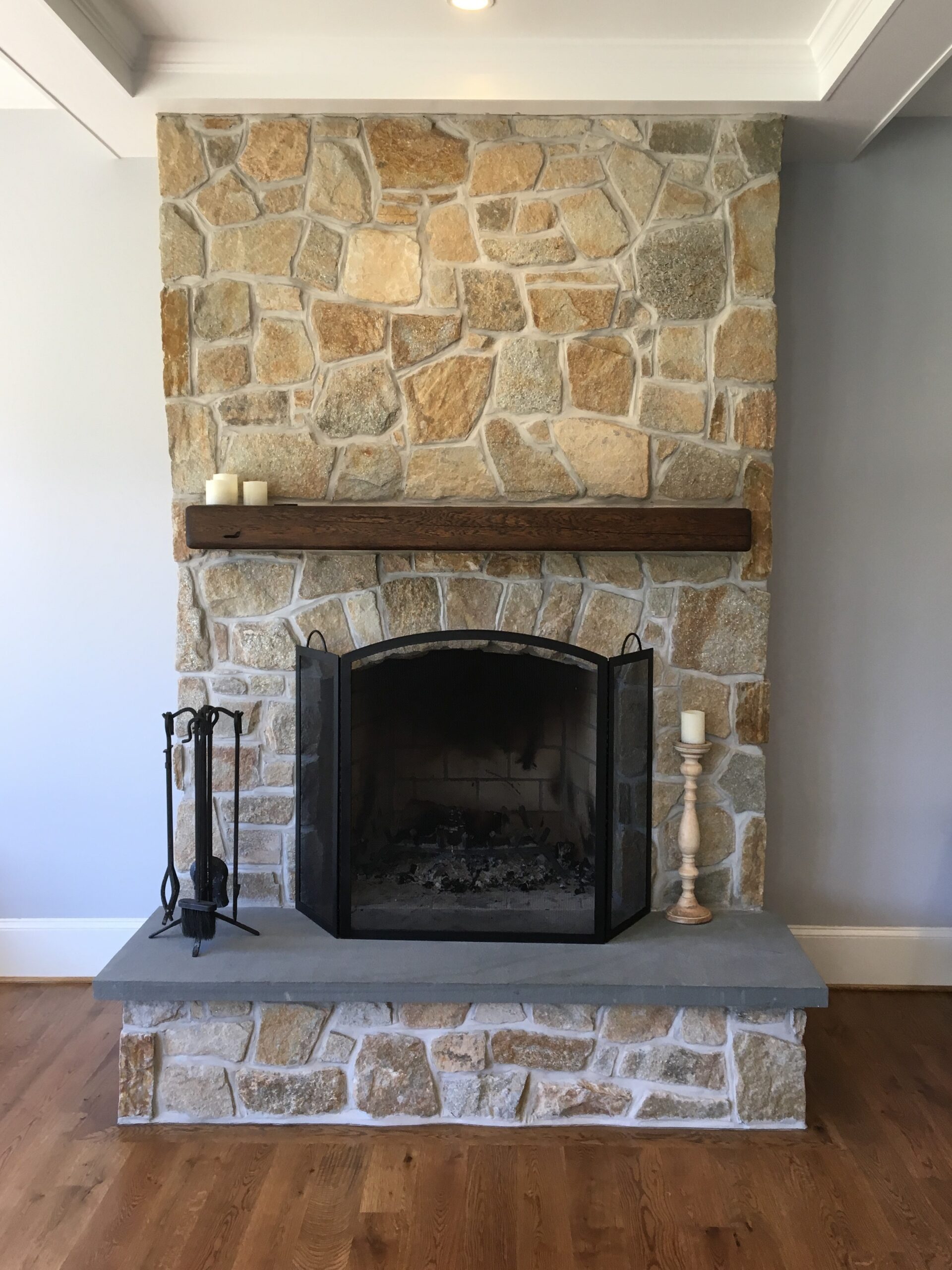 simple design fieldstone fireplace