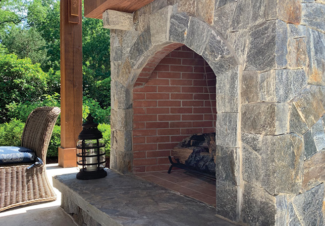 Outdoor fireplace with natural stone veneer