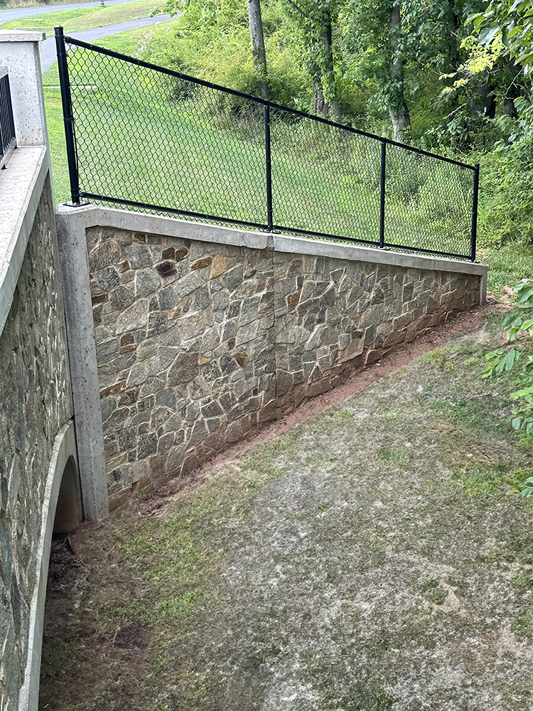 Mosaic Real Stone Veneer installed on a retaining wall