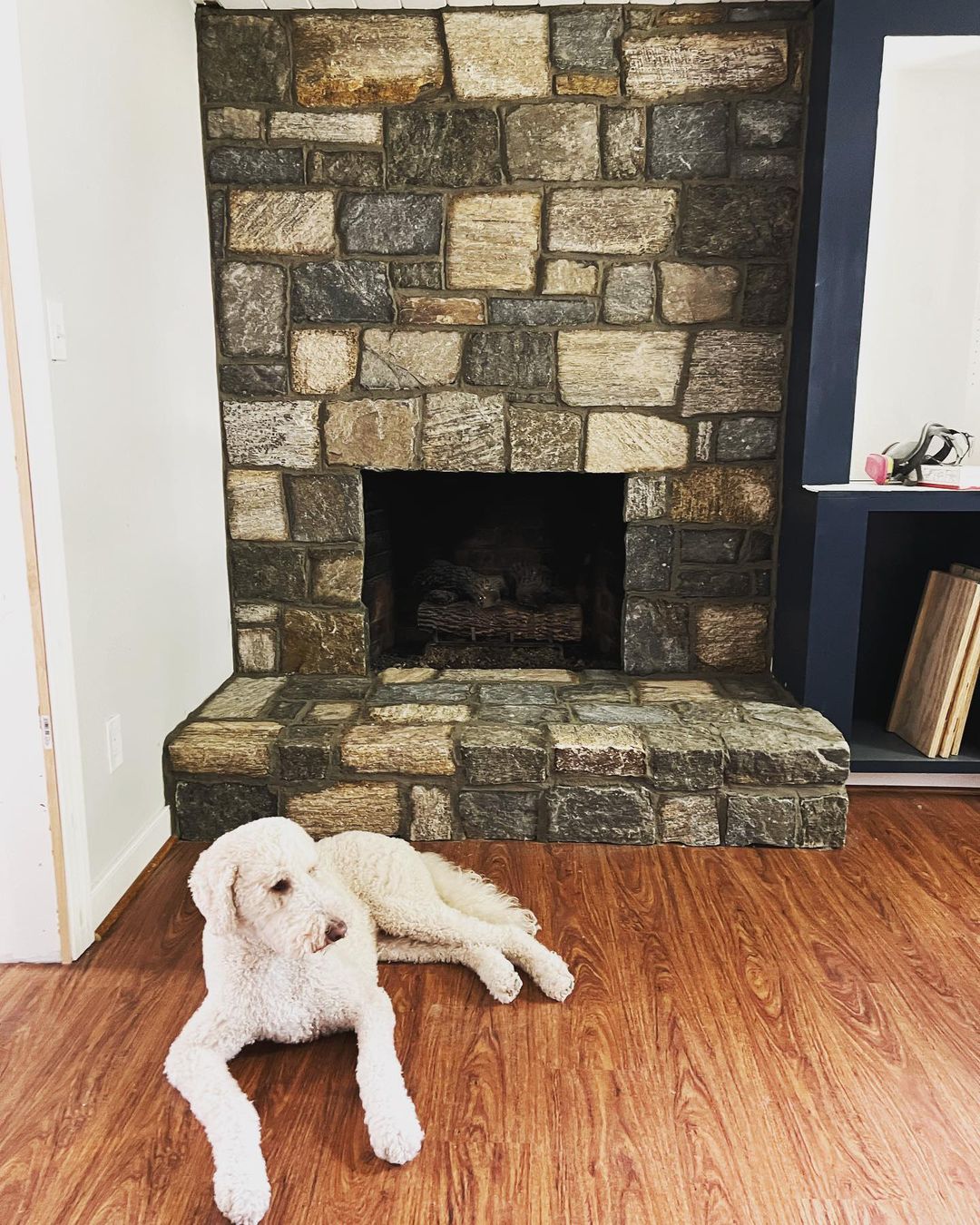 Stone fireplace after the brick was covered with Natural Facing stone veneer